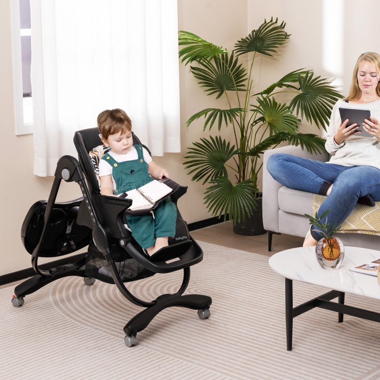 Multifunctional folding baby high chair in black with adjustable height, rolling wheels, and removable tray for easy.