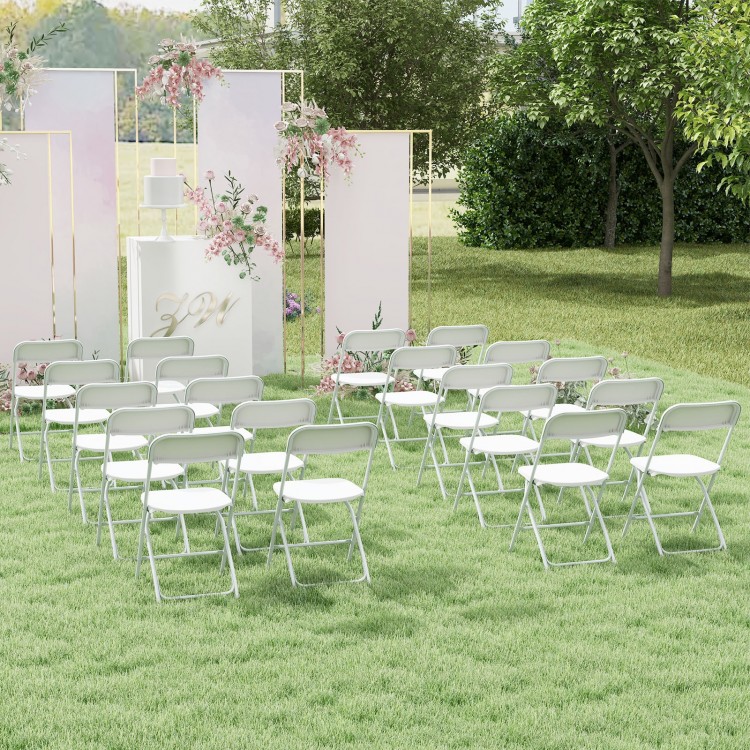 White metal folding chairs arranged for an outdoor wedding, featuring a robust frame and curved backrest for comfort.