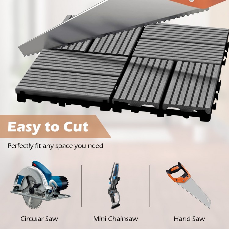 Interlocking deck tiles in gray, showcasing easy cutting with a hand saw, ideal for custom outdoor flooring solutions.