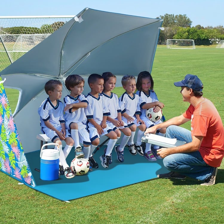 Beach umbrella tent in blue, 7.6 x 7 ft, providing UPF50+ sun protection with mesh windows for ventilation and.