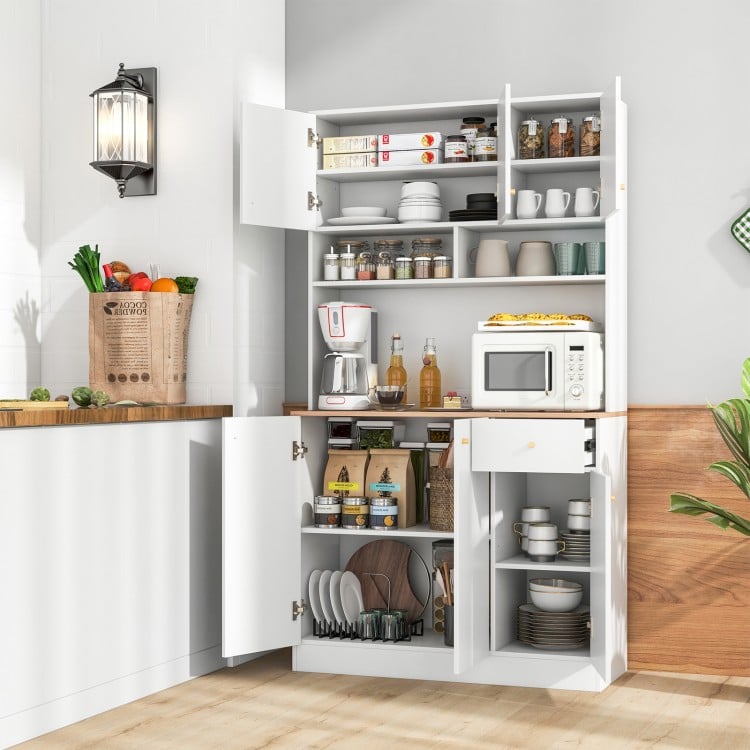 Tall white pantry cabinet with adjustable shelves, outlets, and a pull-out drawer for organized dining room storage.