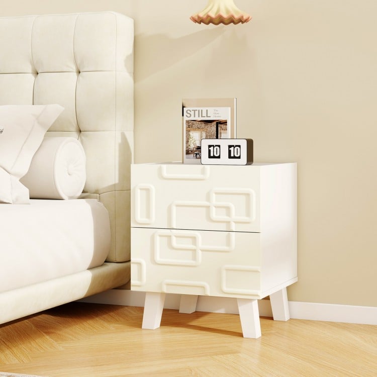 Modern nightstand side table in white with 3D geometric patterns, featuring two spacious drawers for storage.
