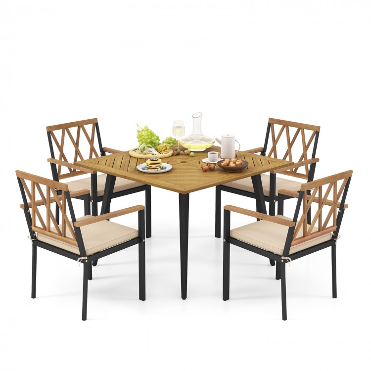 Outdoor dining table with four cushioned chairs, featuring acacia wood and a 1.9-inch umbrella hole, perfect for patio.