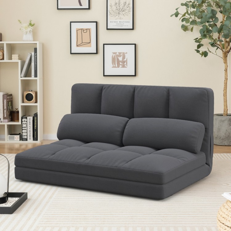 Floor sofa bed in dark gray with adjustable backrest, velvet cover, and two pillows for versatile comfort and.