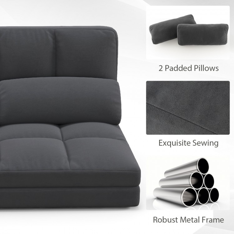 Dark gray floor sofa bed with adjustable backrest, velvet cover, and two padded pillows for versatile comfort.