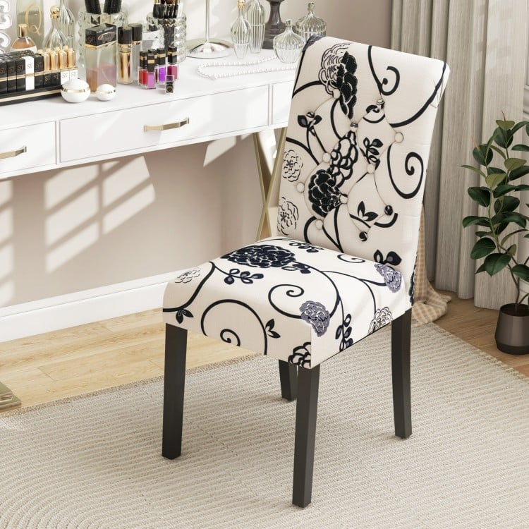 Tufted dining chair with blue and white linen fabric, curved backrest, and sturdy wood legs for stylish comfort.