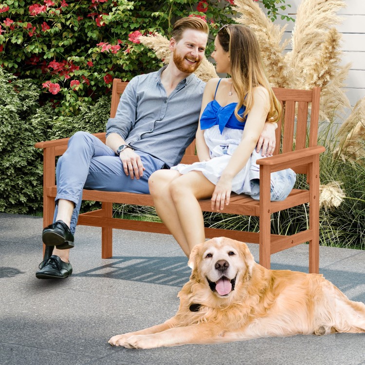 2-person patio loveseat made of solid wood with slatted backrest, ideal for outdoor relaxation in backyards or porches.