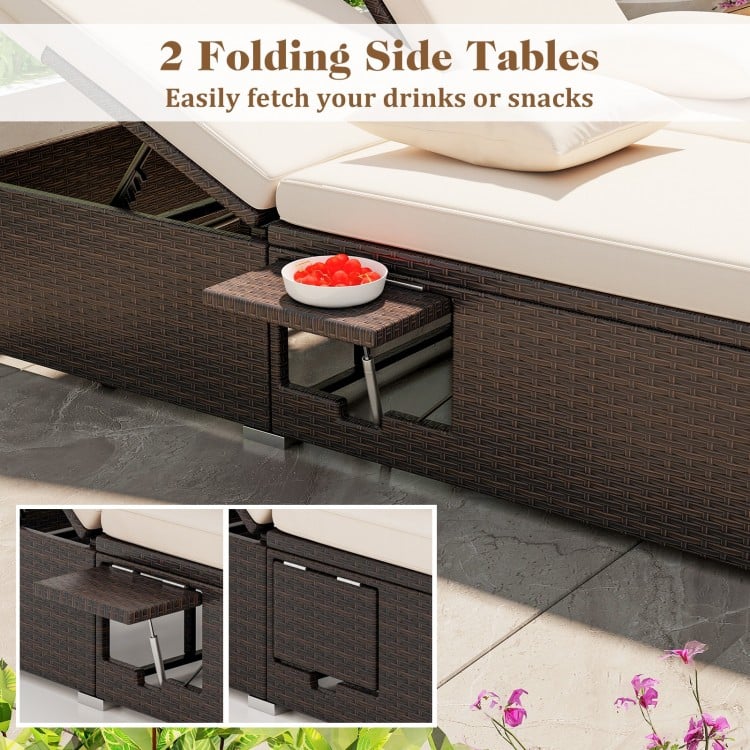 Folding side table on the patio double chaise lounge, featuring rattan surface and soft cushions for outdoor relaxation.