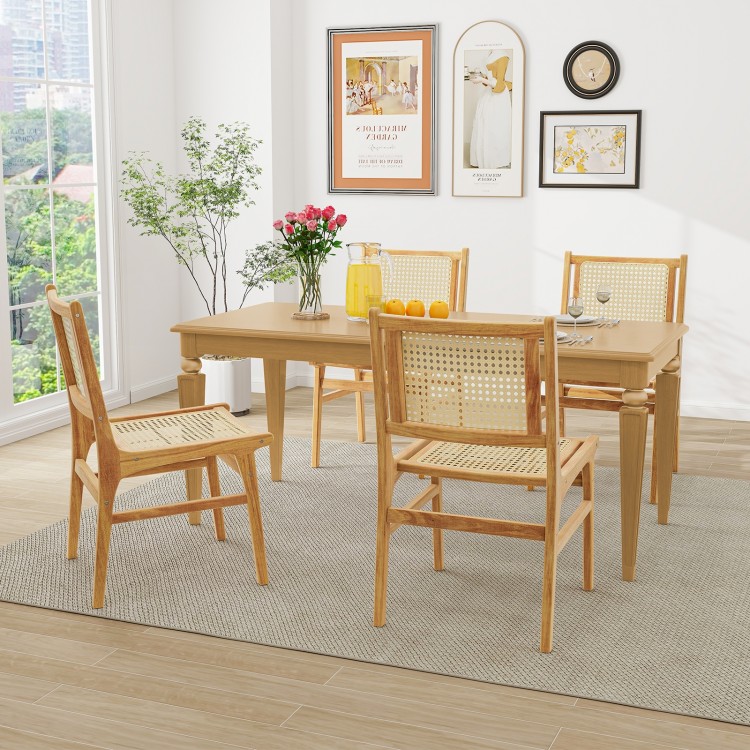Rattan dining chair with natural cane backrest and teak wood frame, ideal for stylish dining spaces.