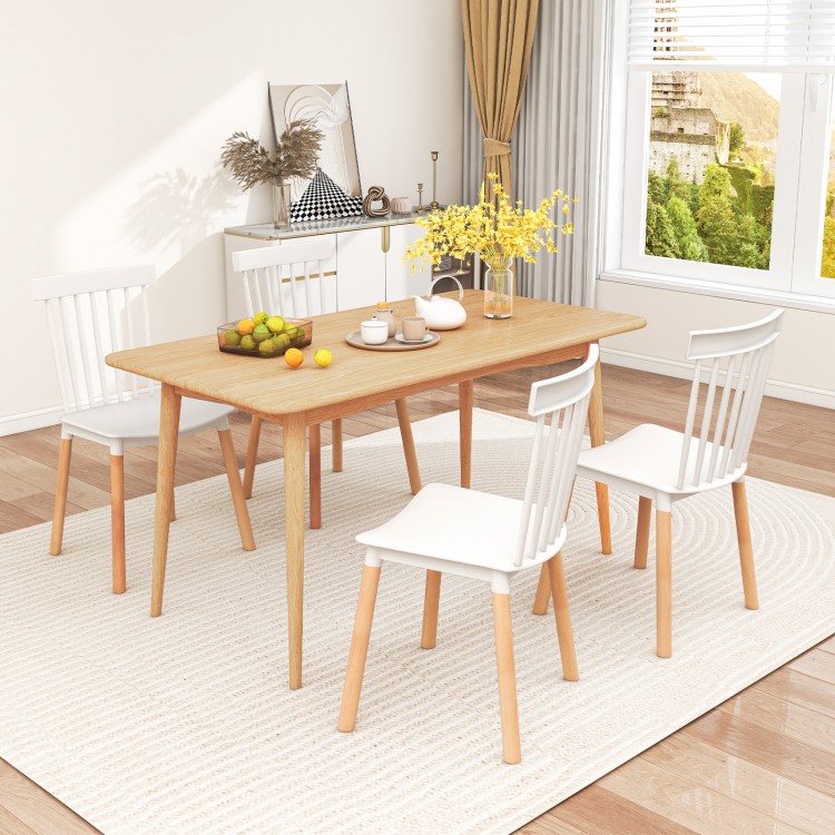 Set of 4 white Windsor dining chairs with spindle backs and curved seats, perfect for kitchen or dining room use.