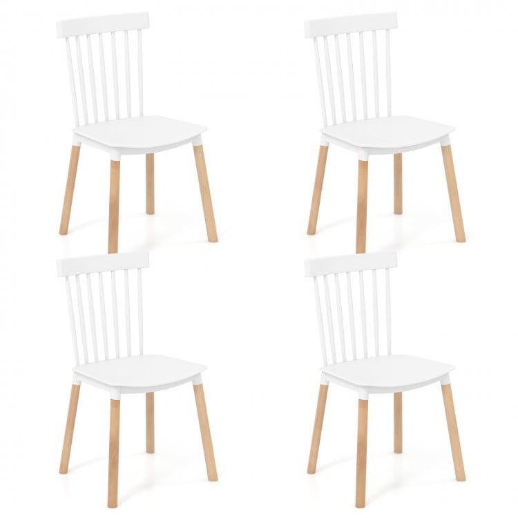 Set of 4 white Windsor dining chairs with spindle backs, curved seats, and sturdy beech wood frames for versatile use.