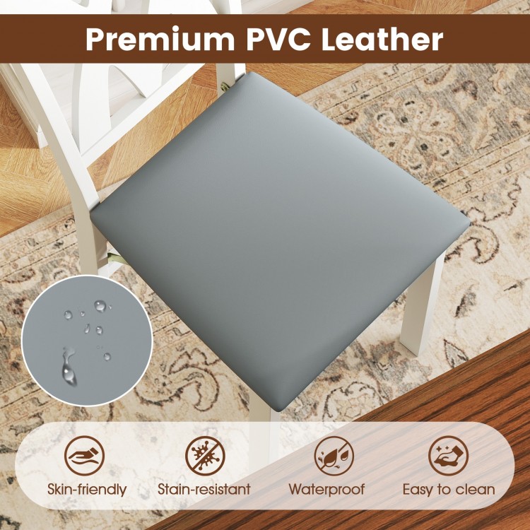 Gray PVC leather seat of a folding wooden dining chair, waterproof and easy to clean, ideal for small spaces.