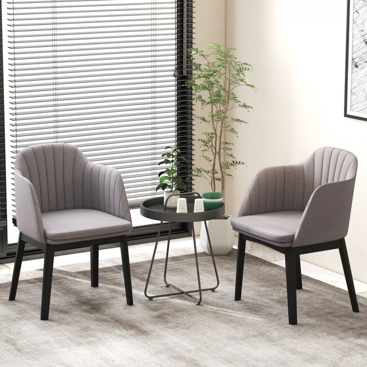 Curved backrest grey upholstered velvet dining chairs set of 2 with solid rubber wood frame for versatile seating.
