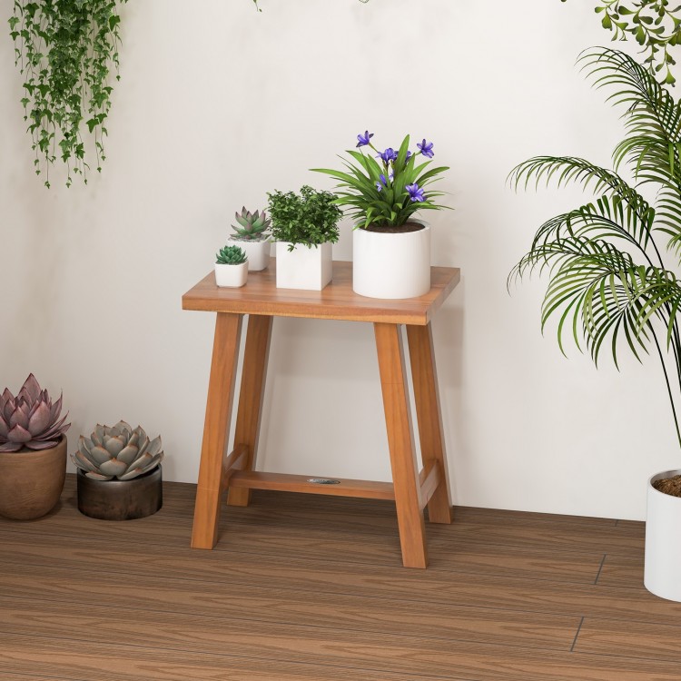 Teak shower stool with solid wood legs, 18" height, ideal as a side table or plant stand for versatile use.