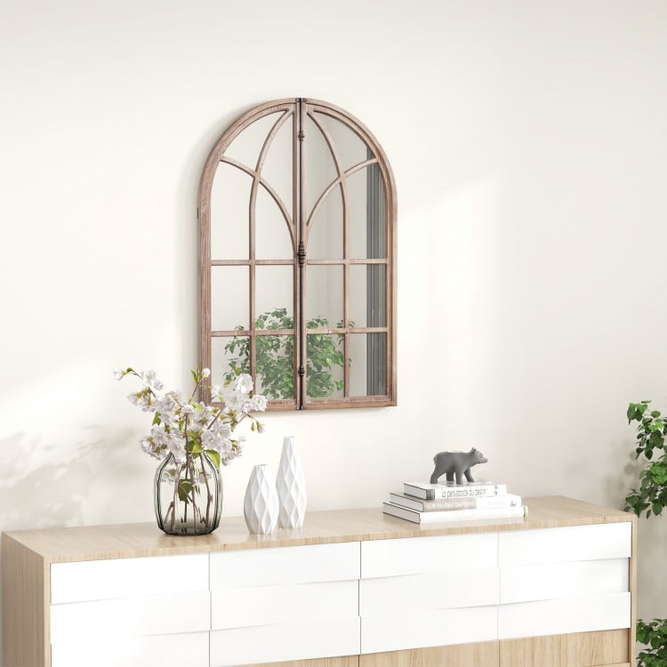 Arched window pane mirror with rustic wooden frame, perfect for living rooms and entryways, enhancing light and charm.