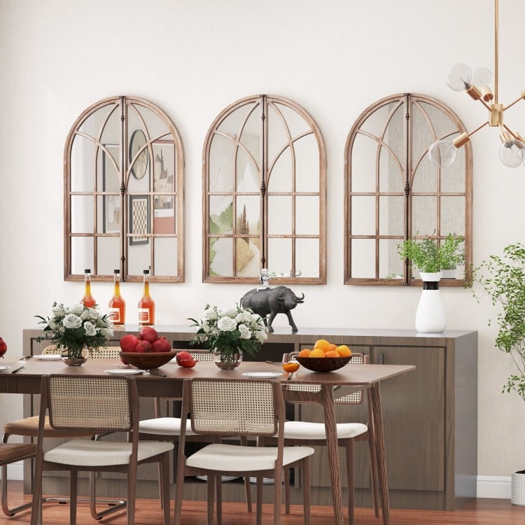 Arched window pane mirrors in a rustic wooden frame, beautifully arranged for a charming living room setting.