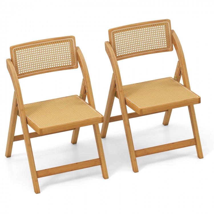 Set of 2 natural rattan cane folding dining chairs with rotatable backrests for optimal comfort and space-saving design.