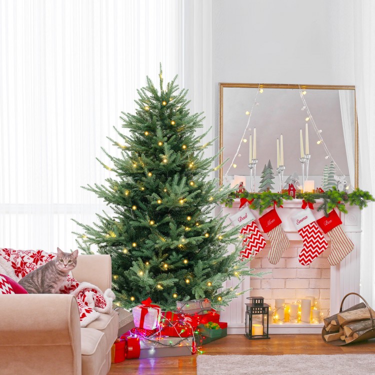 6 FT pre-lit artificial Christmas tree with 778 branch tips, warm white LED lights, and cozy holiday decor.