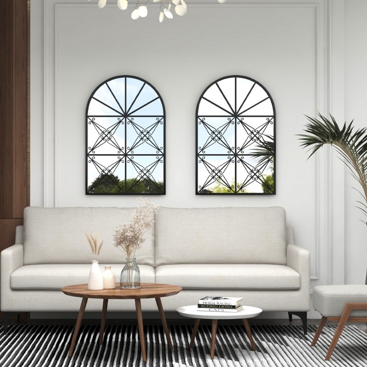 Arched window pane mirror with black metal frame, 23x34 inches, ideal for brightening living rooms and various decor.