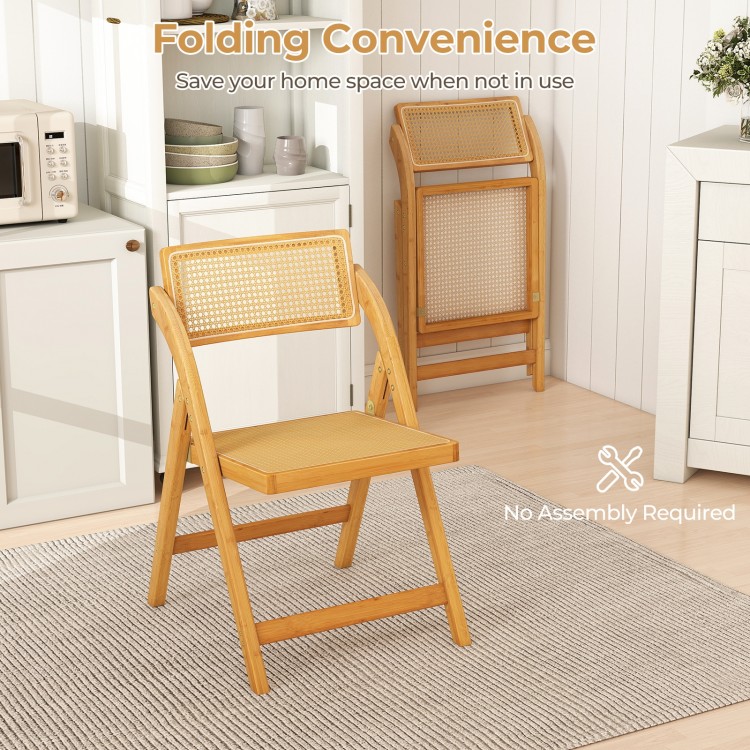 Natural rattan cane folding dining chair with rotatable backrest, ideal for space-saving in kitchen or dining room.
