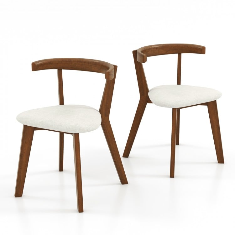Set of 2 walnut wood dining chairs with padded seats and unique curved backrests for versatile home use.