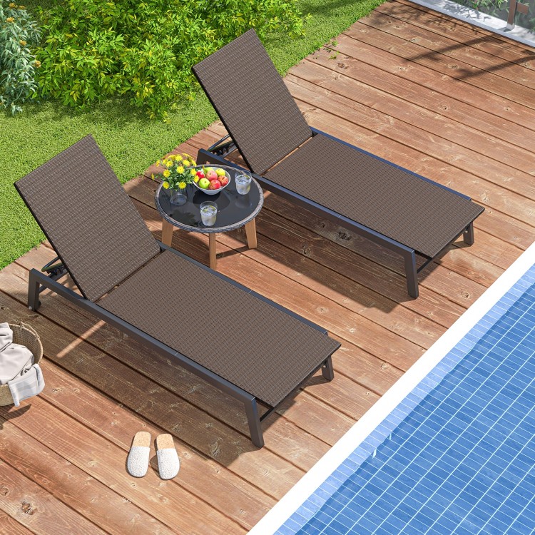 Two adjustable PE wicker chaise lounge chairs with wheels on a wooden deck by the pool, perfect for outdoor relaxation.