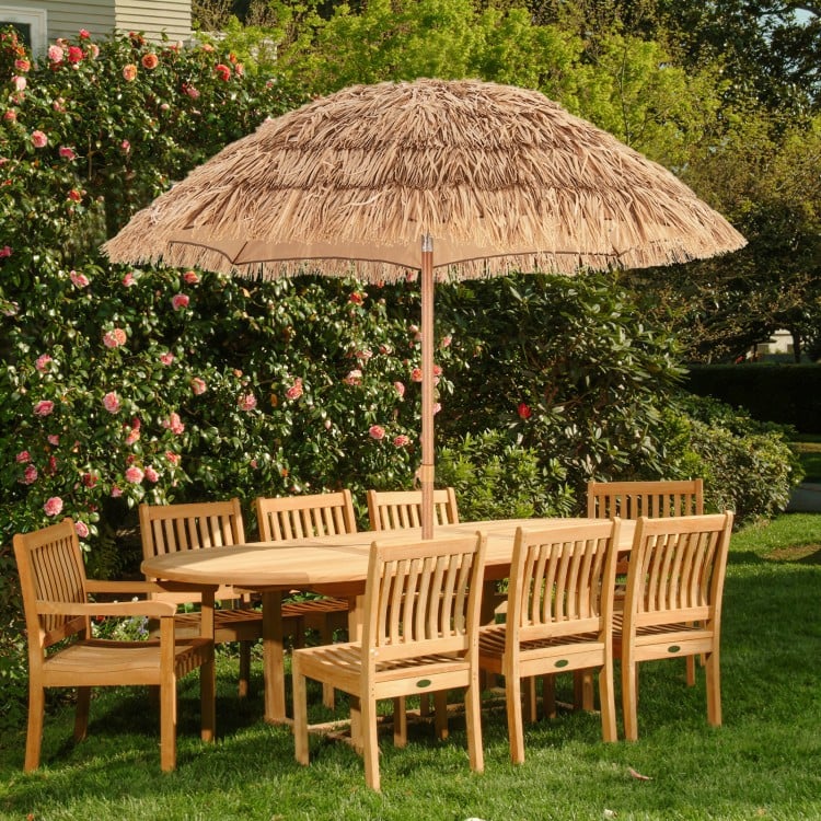 Thatched tiki umbrella with foldable stand, 6.5 feet, natural color, providing sun protection for outdoor dining.