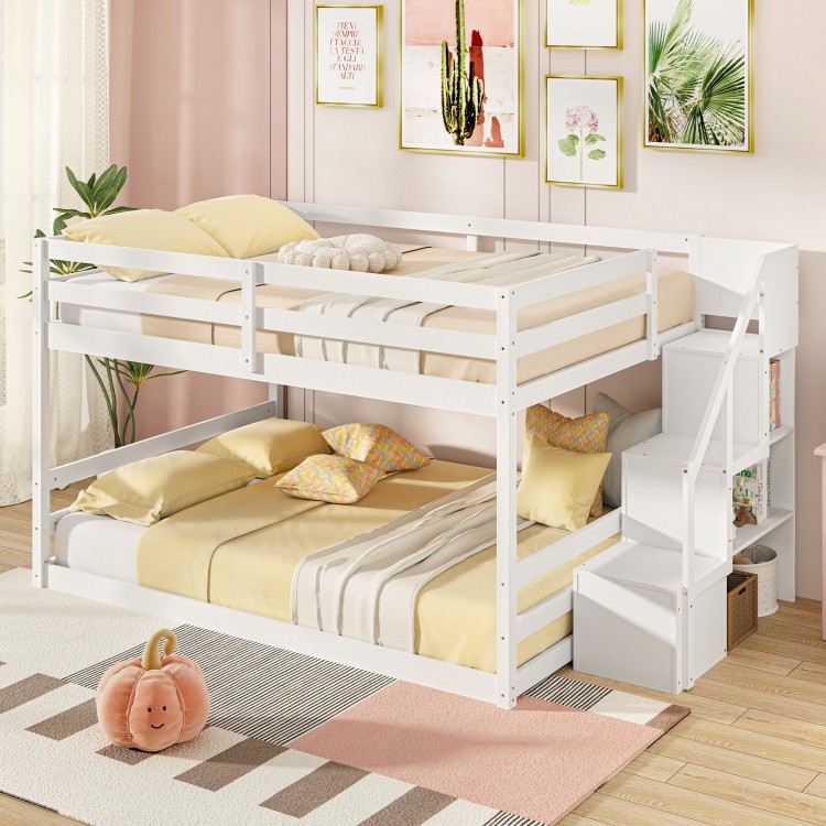 Integrated storage stairs of the solid wood full over full low bunk bed in white, perfect for maximizing space in kids'.