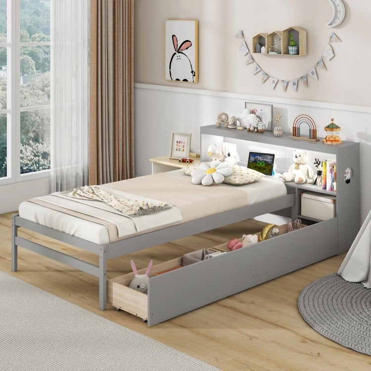 Twin size gray bed frame with LED light, bookcase headboard, and two spacious storage drawers for kids' room.