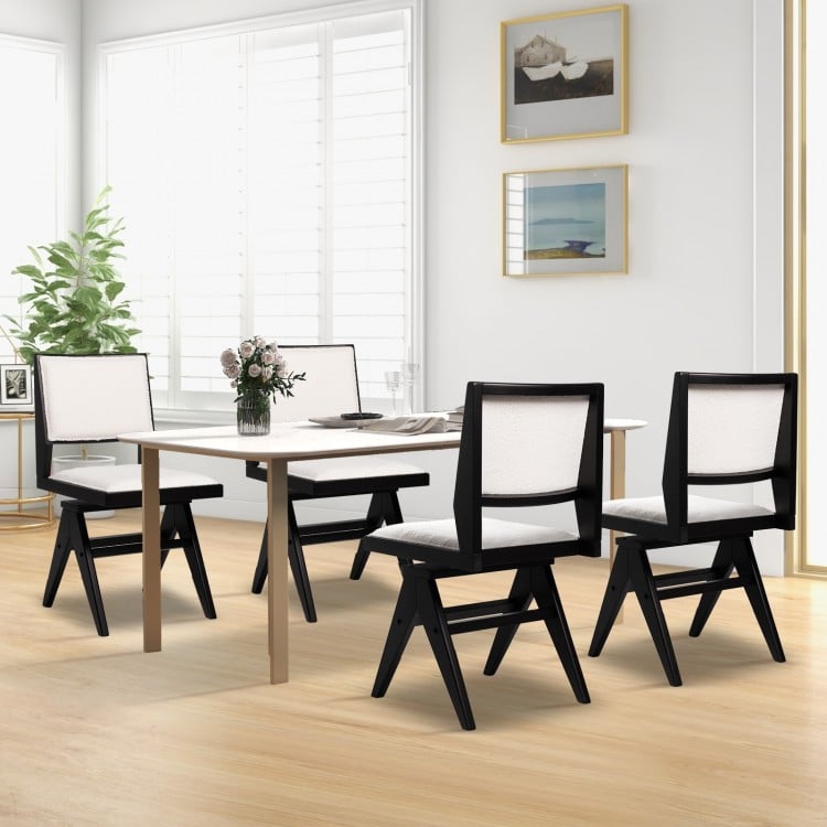Set of two swivel dining chairs with black rubber wood frame and white faux sherpa upholstery, perfect for stylish.