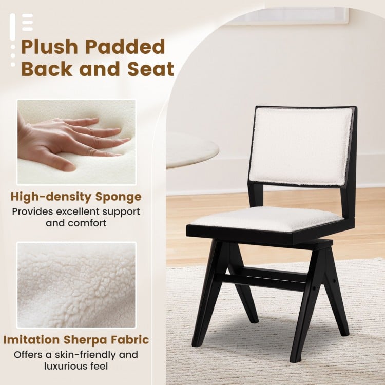 Plush padded seat and back of a swivel wooden dining chair in white faux sherpa fabric for stylish comfort.
