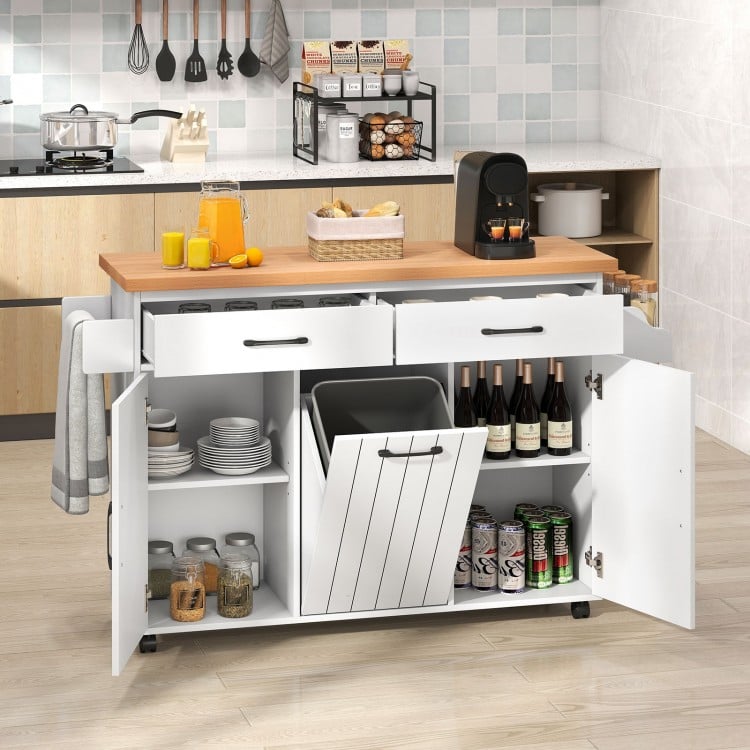 Mobile kitchen island table in white with adjustable shelves, trash bag storage, and a spacious prep area for dining.