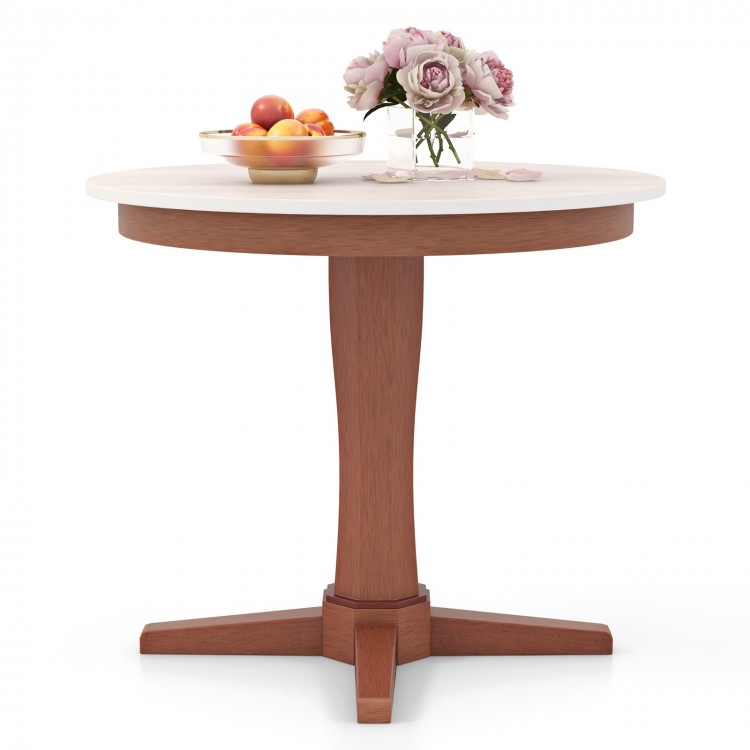 Round wooden dining table with pedestal base in cream white, featuring a sturdy rubber wood frame, ideal for gatherings.
