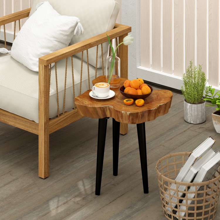 Irregular solid teak wood end table with mahogany tapered legs, perfect for indoor or outdoor use beside a sofa.