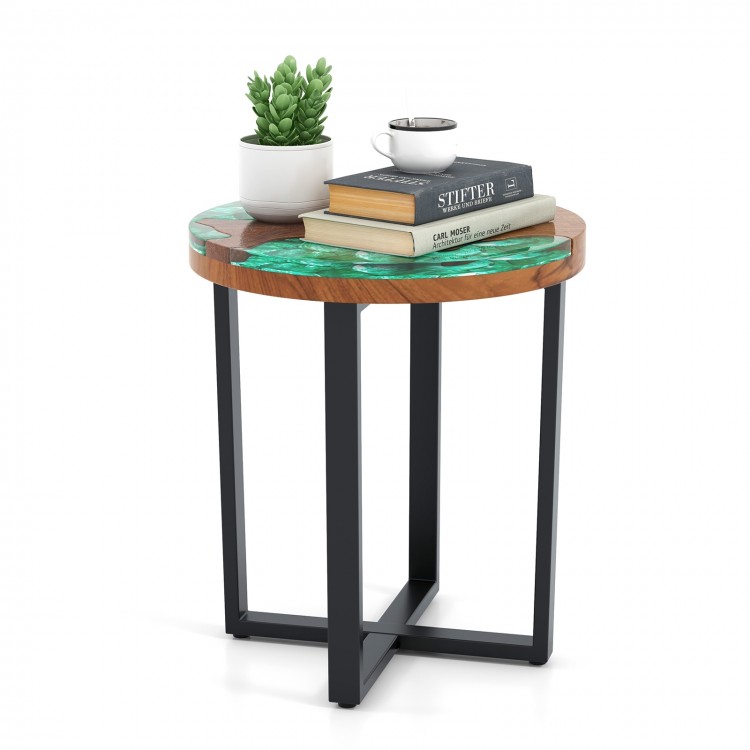 Round teak wood outdoor end table with epoxy resin top, featuring X-shaped legs for stability, perfect for patio use.