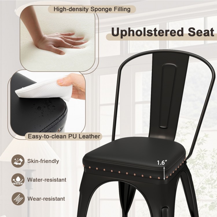 Close-up of the black PU leather cushioned seat of a stackable metal dining chair, featuring high-density sponge.