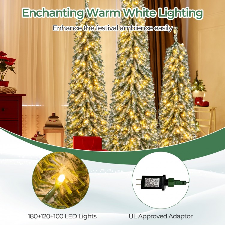 Artificial Christmas tree set of 3 with realistic snow and 100+ LED lights, perfect for festive home decoration.
