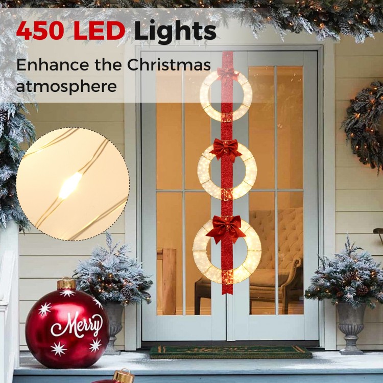 Set of 3 Christmas lighted wreaths with warm white LED lights and bows, perfect for enhancing festive doorways.