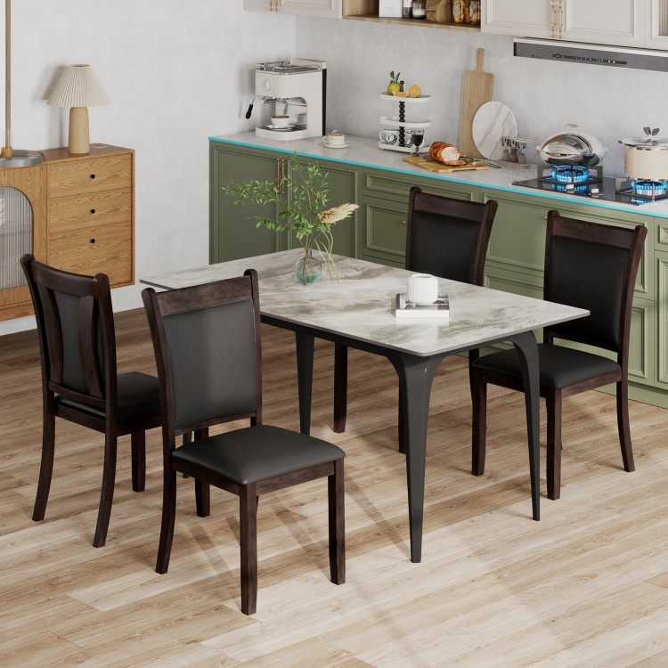 Set of two gray faux leather upholstered dining chairs with padded seats, perfect for kitchen or dining room use.