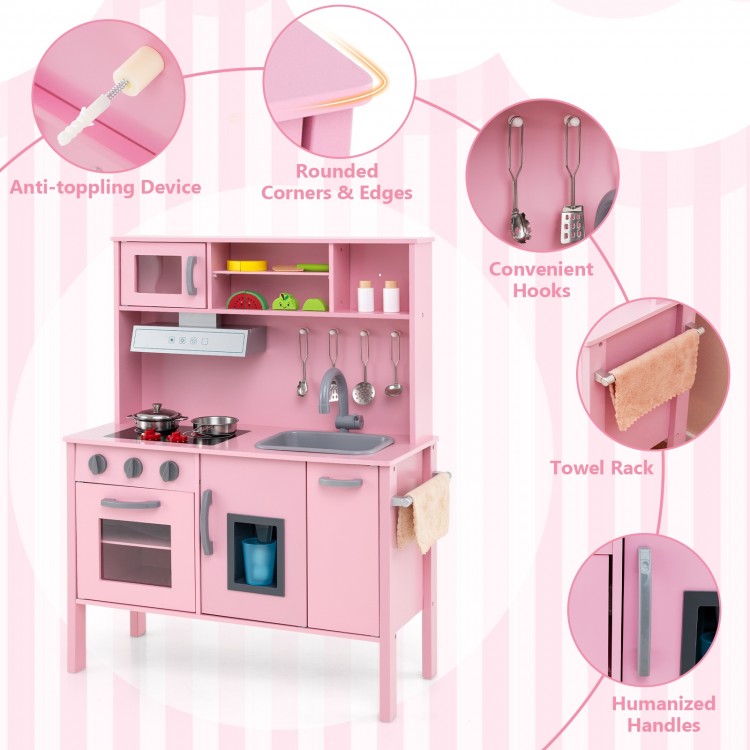 Wooden pretend play kitchen set in pink with microwave, oven, and removable sink for toddlers' imaginative play.