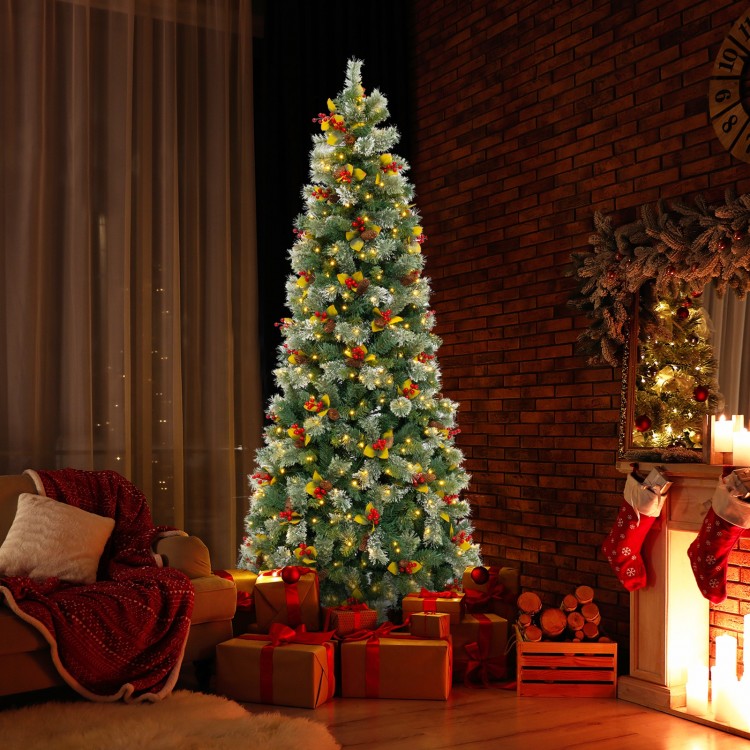 Pre-lit artificial Christmas tree with red berries and pine cones, featuring warm-white LED lights for festive decor.