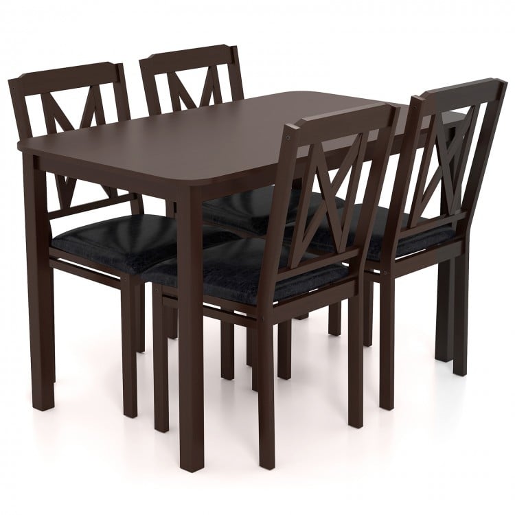 5-piece dining table set with rubber wood legs, featuring a wide tabletop and padded chairs upholstered in PU leather.