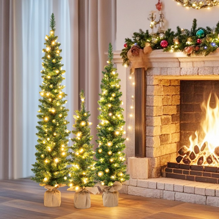 Set of 3 pre-lit artificial Christmas trees with warm white LED lights, perfect for enhancing festive spirit in any.