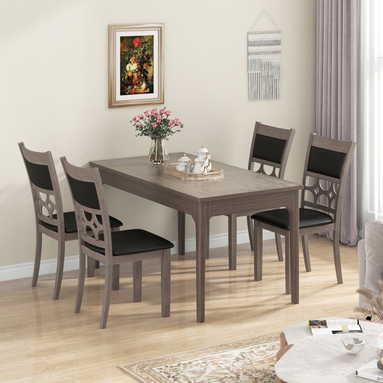 Elegant dining table set with gray upholstered chairs, featuring a hollowed backrest design for enhanced comfort and.