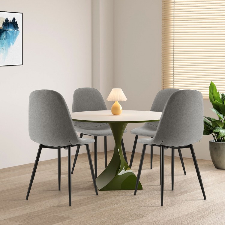 Set of 4 gray dining chairs with black metal legs, featuring foam upholstery and ergonomic backrests for comfort.