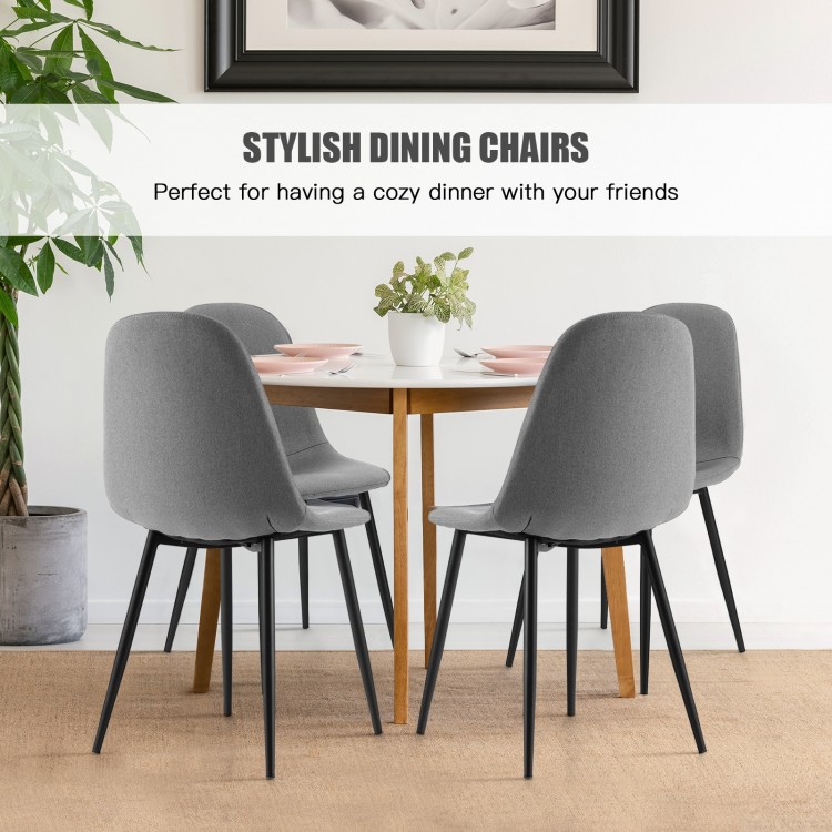 Set of 4 gray dining chairs with black metal legs, featuring foam upholstery and ergonomic backrest for comfort.