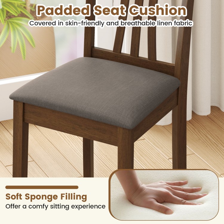 Padded seat cushion of a wooden dining chair set, featuring breathable linen fabric and soft sponge filling for comfort.