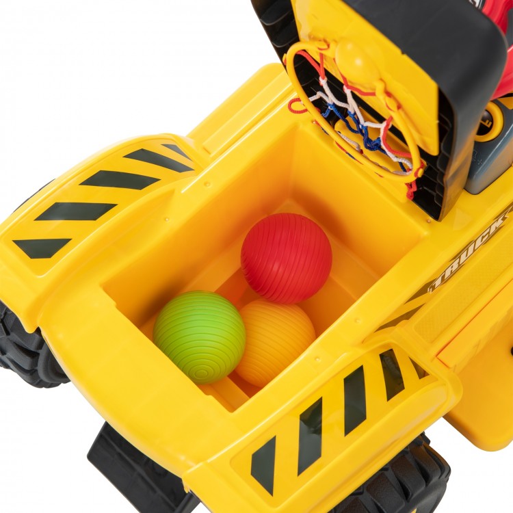 Yellow kids' ride-on excavator with hidden storage, featuring three colorful balls and a foldable basketball hoop.