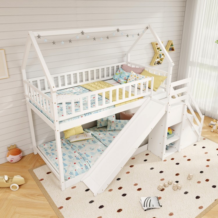Twin over twin bunk bed in white with slide, staircase, and decorative house-shaped frame for kids' playroom.