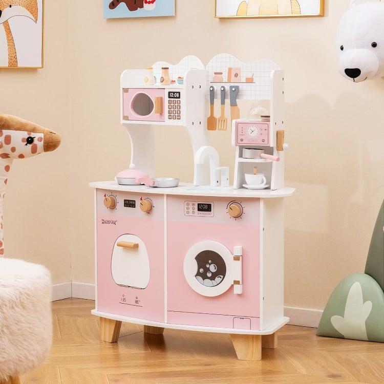 Wooden kids kitchen playset in pink featuring a coffee maker, microwave, oven, and realistic knobs for imaginative play.